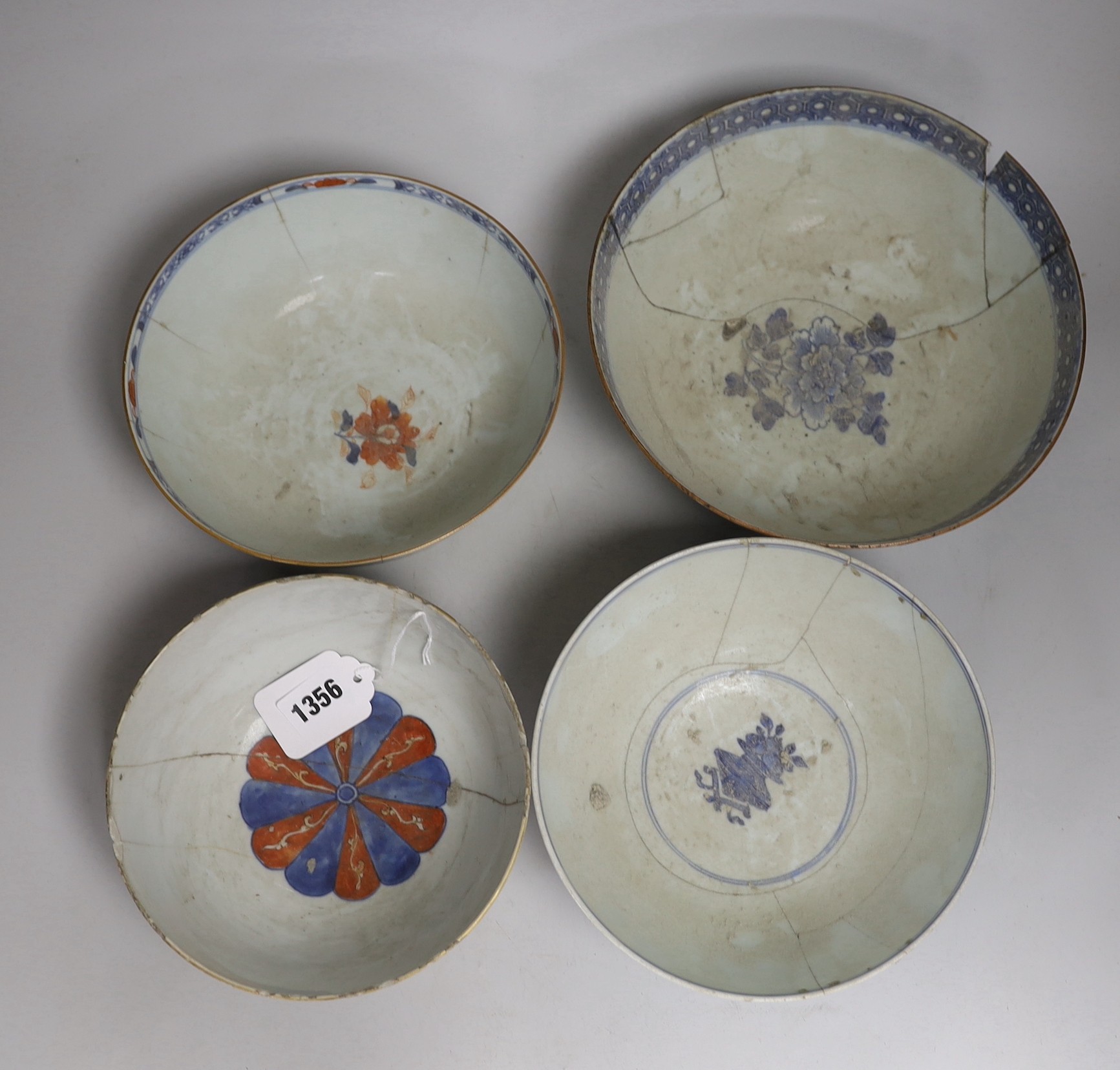 Four 18th century Chinese bowls, one painted in underglaze blue with the eight immortals, with six character Qianlong seal mark and of the period, largest 24cm diameter